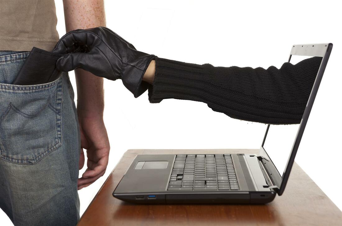 a hand reaching through a laptop to steal a wallet from a man