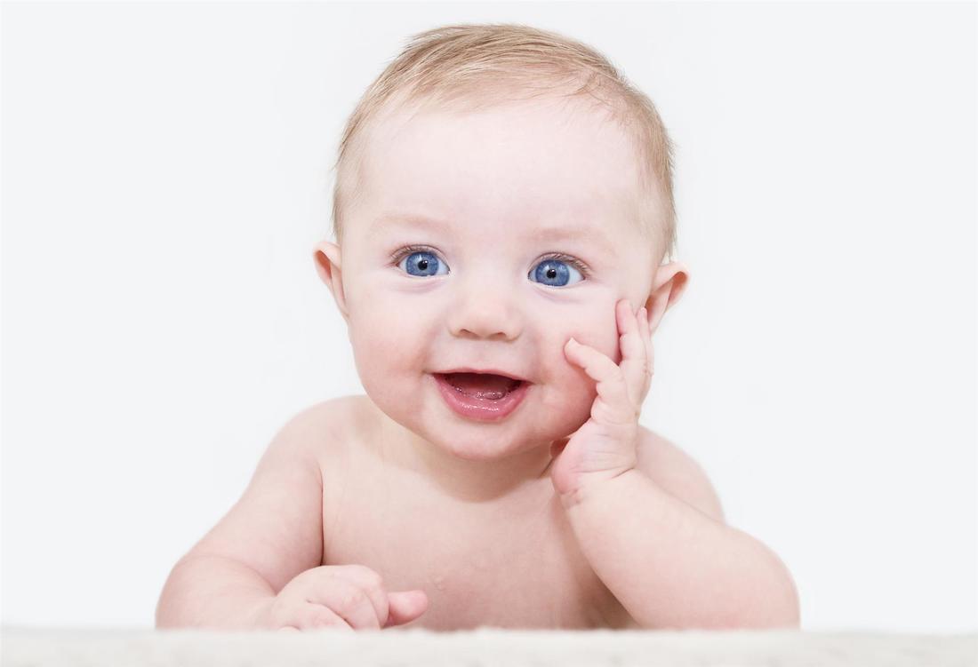 blue eyed infant smiling